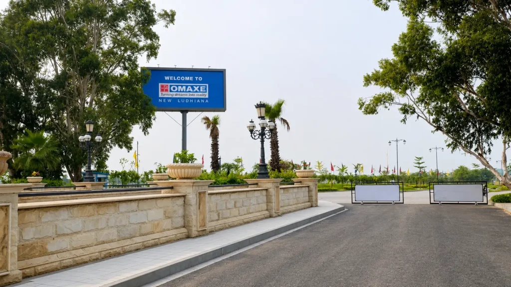 Omaxe New Ludhiana entrance gate with landscaped surroundings